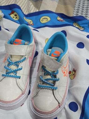 Nike Kids White Sneakers with Pink Trim and Blue Lining